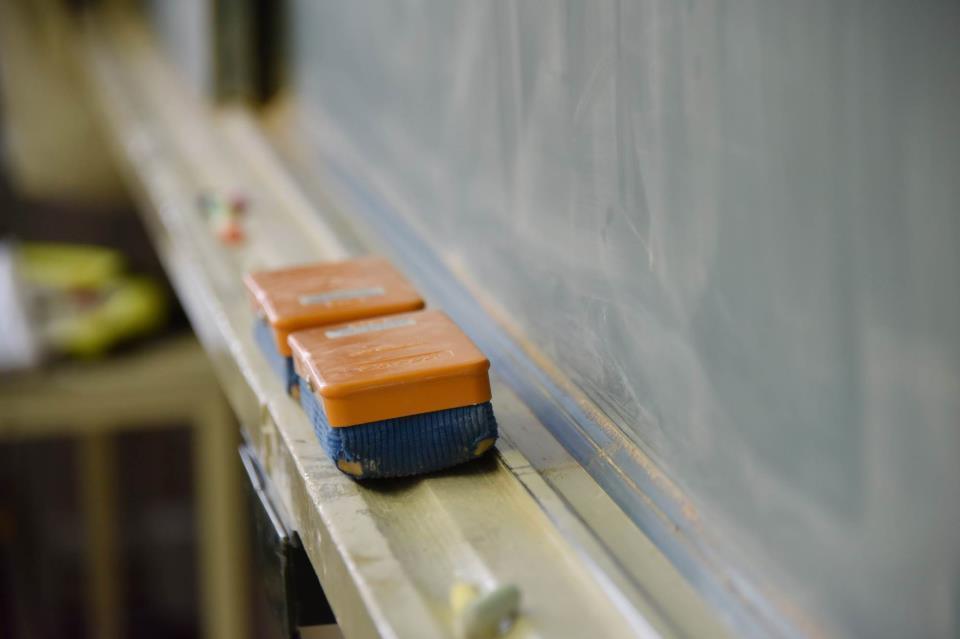 Close-up of chalk and blackboard eraser